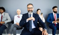 Group of business people with senior leader at front