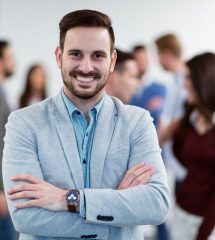 Group picture of successful businessman posing in office